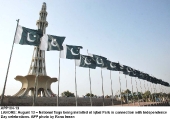 August National flags being installed at Iqbal Park in connection with Independence Day celebrations. APP photo by Rana Imran